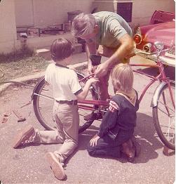 Bike restoration 19 seventy-somethin'. Me in scout uniform. Dad's project in background ('55 T-bird).